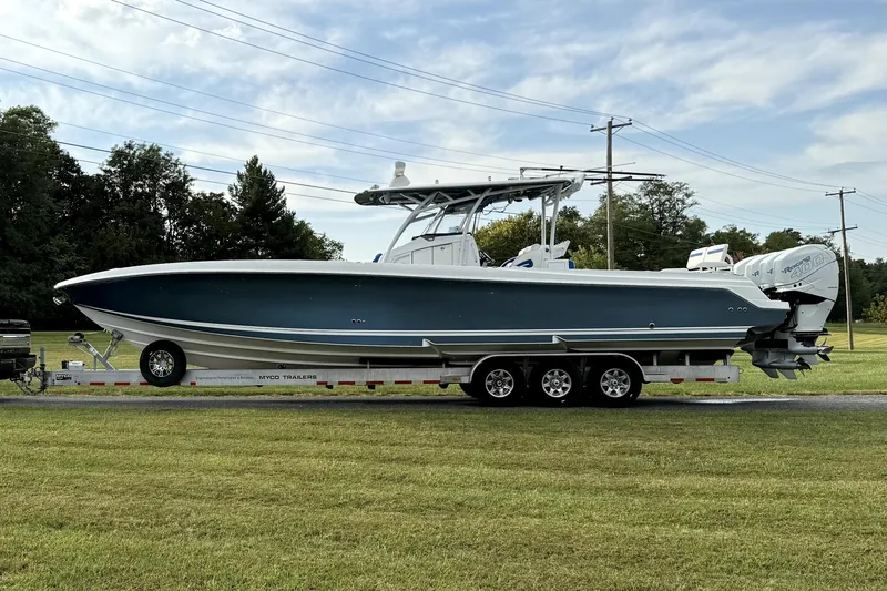  Yacht Photos Pics 2017 Nor-Tech 392 Superfish boat on trailer, parked on grass under a clear sky.
