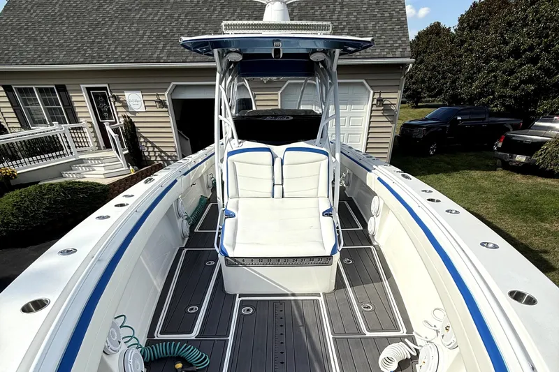  Yacht Photos Pics 2017 Nor-Tech 392 Superfish boat with sleek design, parked near a house.