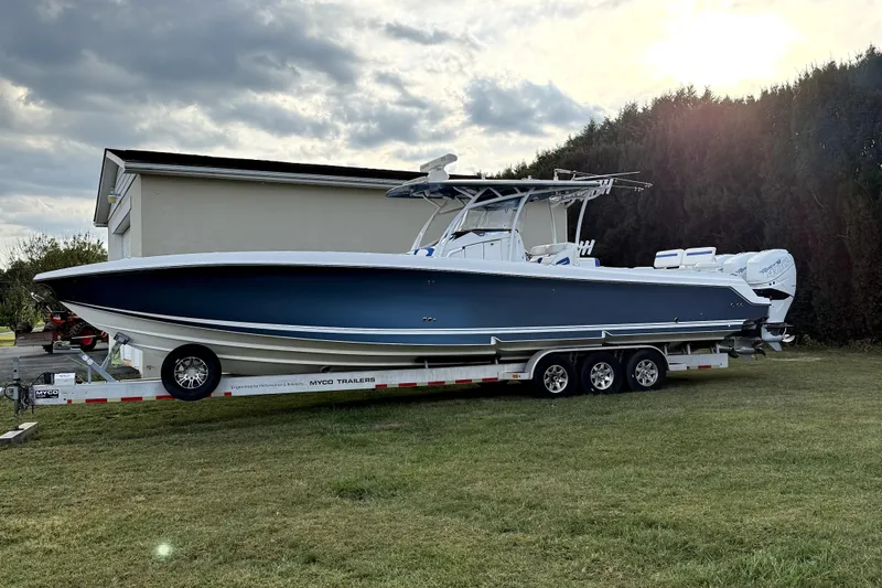  Yacht Photos Pics 2017 Nor-Tech 392 Superfish boat on trailer, parked on grass under cloudy sky.