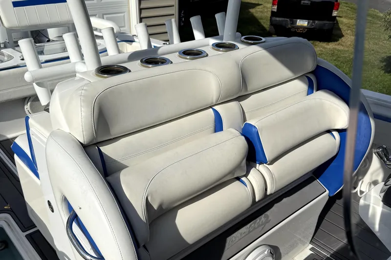  Yacht Photos Pics 2017 Nor-Tech 392 Superfish boat seating with cup holders, featuring white and blue upholstery.