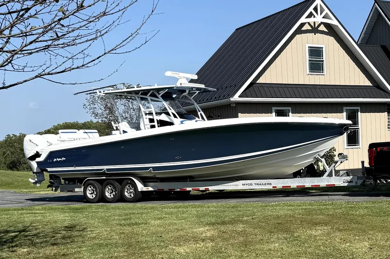  Yacht Photos Pics 2017 Nor-Tech 392 Superfish boat on trailer, parked near a house.