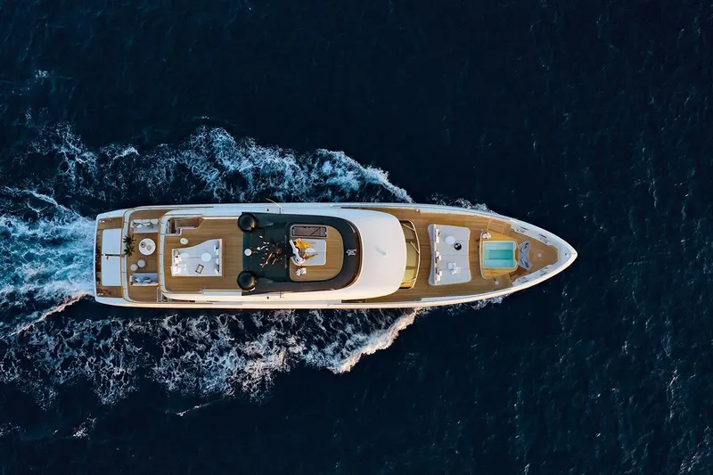 Koju Yacht Photos Pics Aerial view of 2022 Benetti Motopanfilo yacht cruising on the ocean.