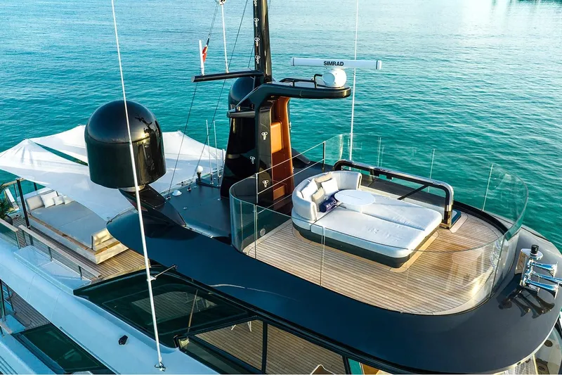 Koju Yacht Photos Pics Luxurious 2022 Benetti Motopanfilo yacht with elegant deck and modern seating area.