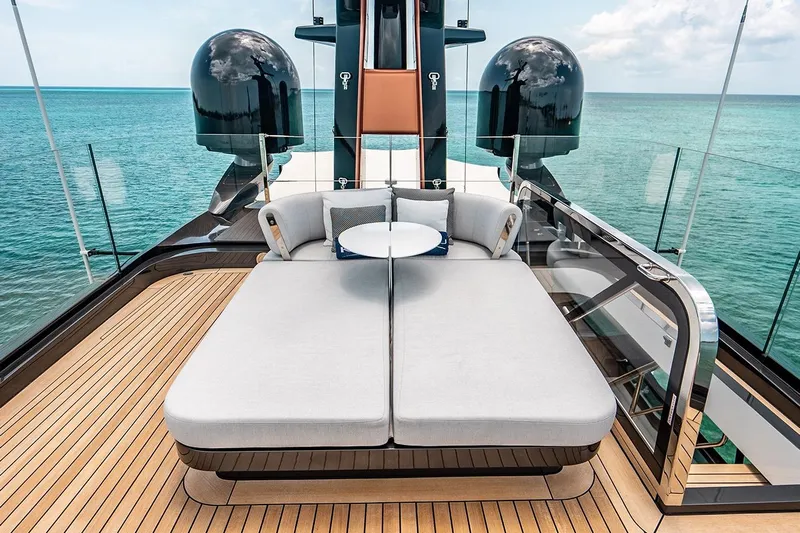 Koju Yacht Photos Pics Luxurious 2022 Benetti Motopanfilo yacht deck with elegant seating and ocean view.