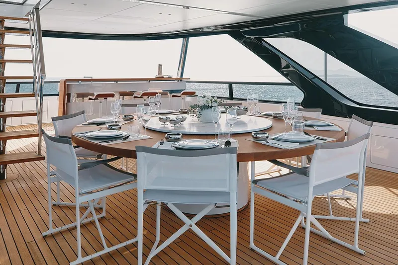 Koju Yacht Photos Pics Luxurious dining area on 2022 Benetti Motopanfilo yacht with ocean view.