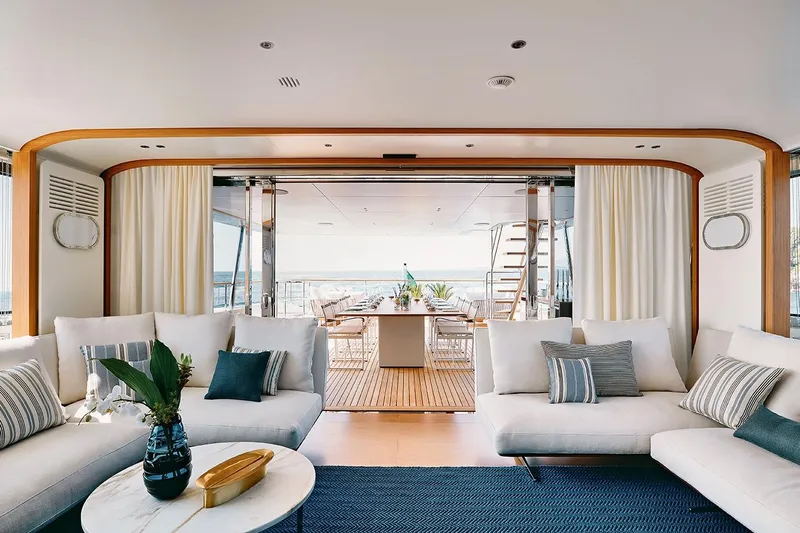 Koju Yacht Photos Pics Luxurious interior of 2022 Benetti Motopanfilo yacht with elegant seating and ocean view.