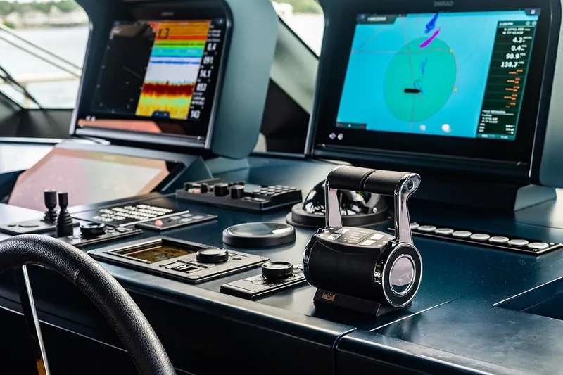 Koju Yacht Photos Pics Control panel of 2022 Benetti Motopanfilo yacht with navigation screens and throttle.