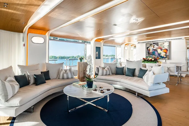 Koju Yacht Photos Pics Luxurious interior of 2022 Benetti Motopanfilo yacht with elegant seating and ocean view.