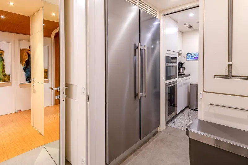 Koju Yacht Photos Pics Modern kitchen interior on 2022 Benetti Motopanfilo yacht, featuring sleek appliances and elegant design.