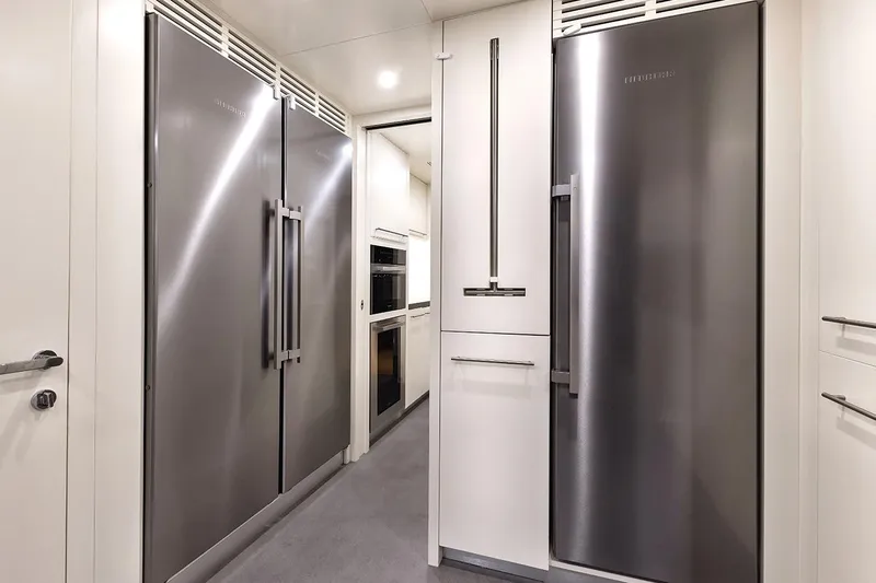 Koju Yacht Photos Pics Modern kitchen with stainless steel appliances on a 2022 Benetti Motopanfilo yacht.