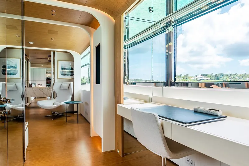 Koju Yacht Photos Pics Luxurious interior of 2022 Benetti Motopanfilo yacht with modern furnishings and panoramic windows.