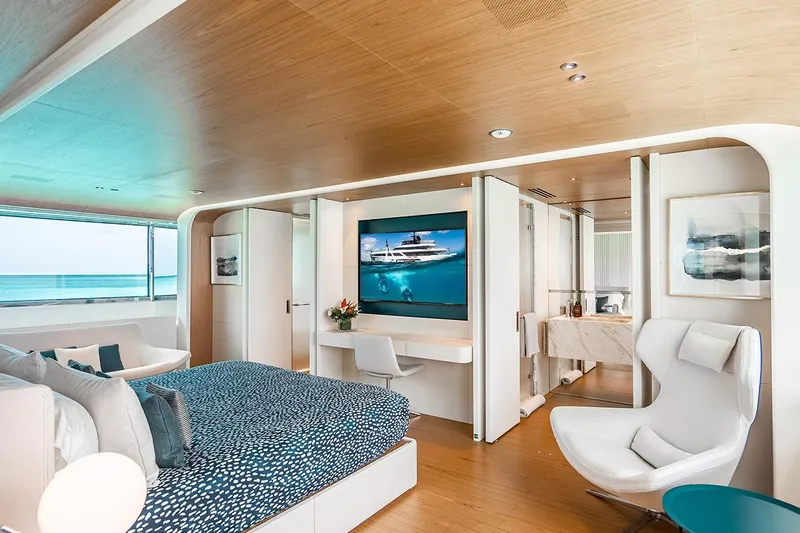 Koju Yacht Photos Pics Luxurious 2022 Benetti Motopanfilo yacht bedroom with modern decor and ocean view.