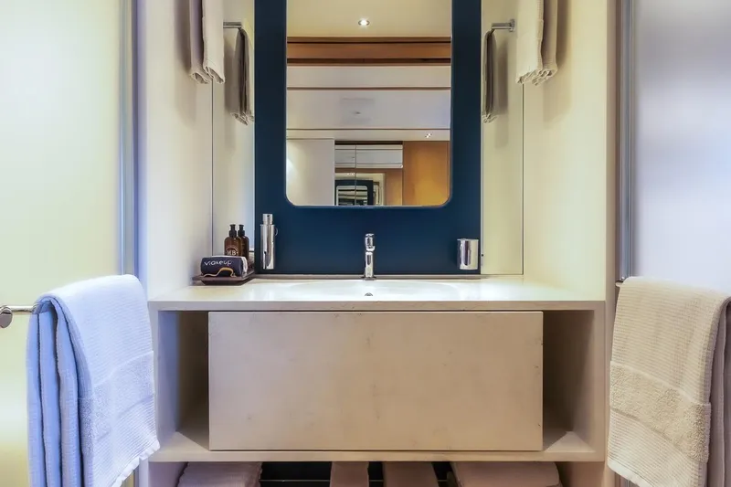 Koju Yacht Photos Pics Elegant bathroom interior on 2022 Benetti Motopanfilo yacht, featuring modern sink and mirror.