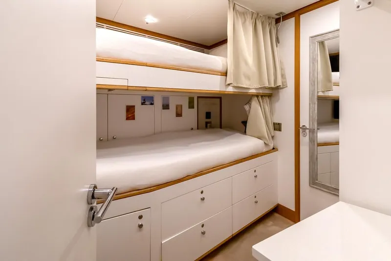Koju Yacht Photos Pics Interior of 2022 Benetti Motopanfilo yacht with bunk beds and modern decor.