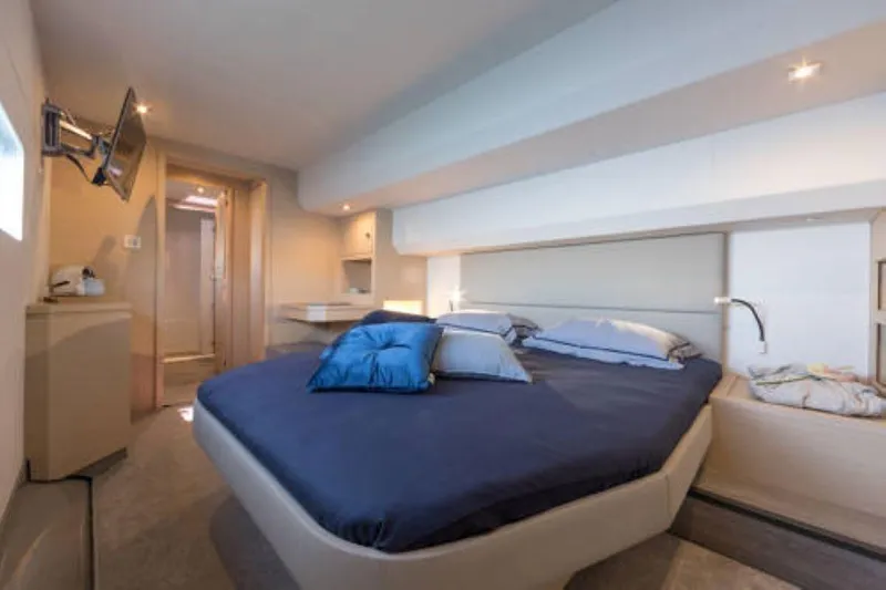 Mona Lisa Yacht Photos Pics Luxurious bedroom interior of 2024 Fountaine Pajot MY.6 yacht with modern design.