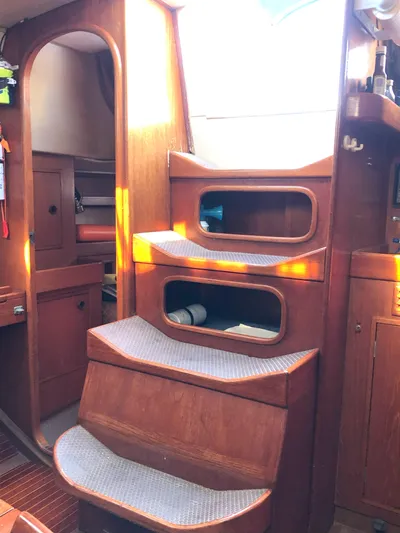 Kokomo Yacht Photos Pics Interior of 1988 Nautor Swan 36-2 sailboat with wooden steps and cozy cabin.