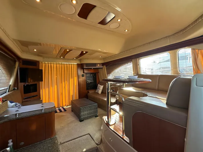  Yacht Photos Pics Luxurious interior of 2005 Sea Ray 420 Sedan Bridge yacht with elegant seating and modern amenities.