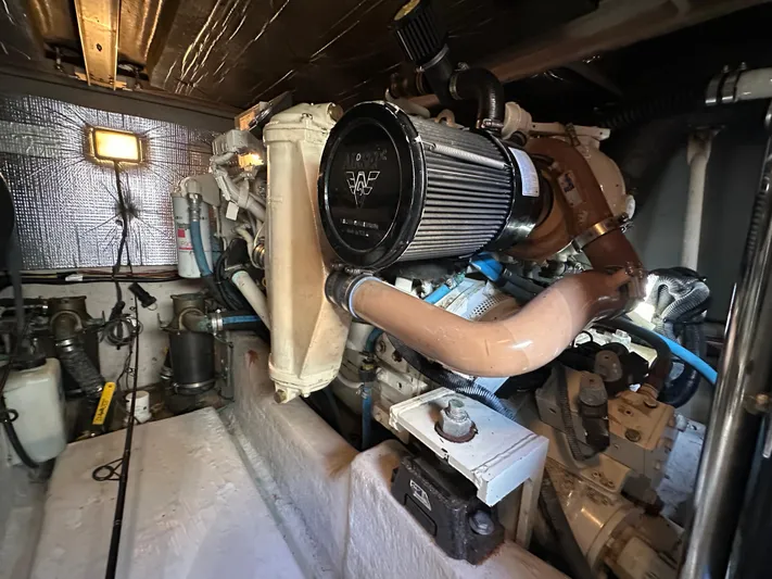  Yacht Photos Pics Engine room of 2005 Sea Ray 420 Sedan Bridge, showcasing mechanical components and systems.