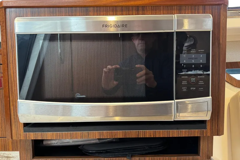  Yacht Photos Pics Frigidaire microwave in 2018 Pursuit OS 325 Offshore boat kitchen setting.
