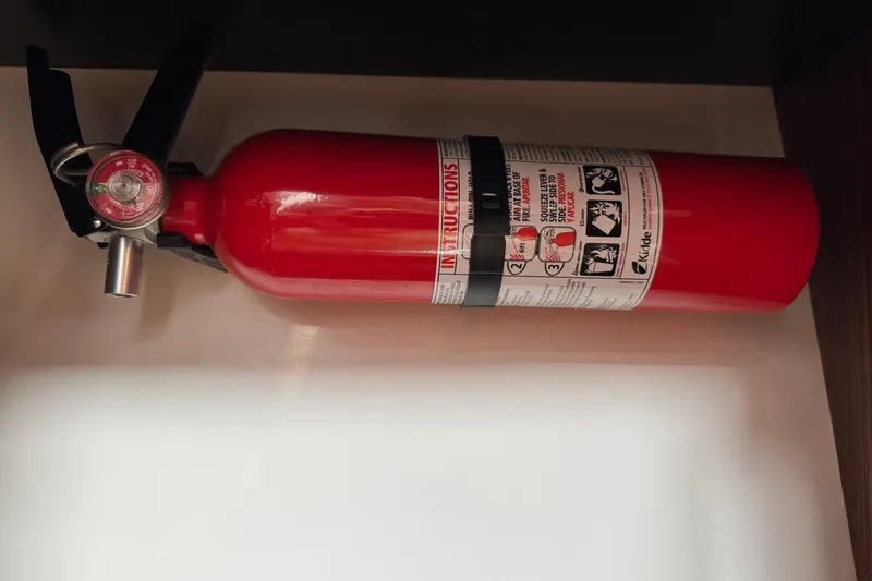  Yacht Photos Pics Red fire extinguisher mounted on a 2018 Pursuit OS 325 Offshore boat.