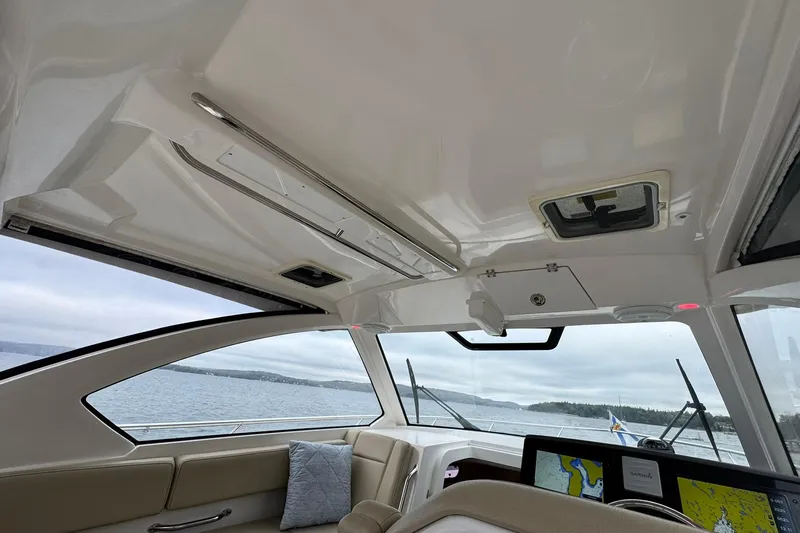  Yacht Photos Pics Interior view of 2018 Pursuit OS 325 Offshore boat with navigation system.