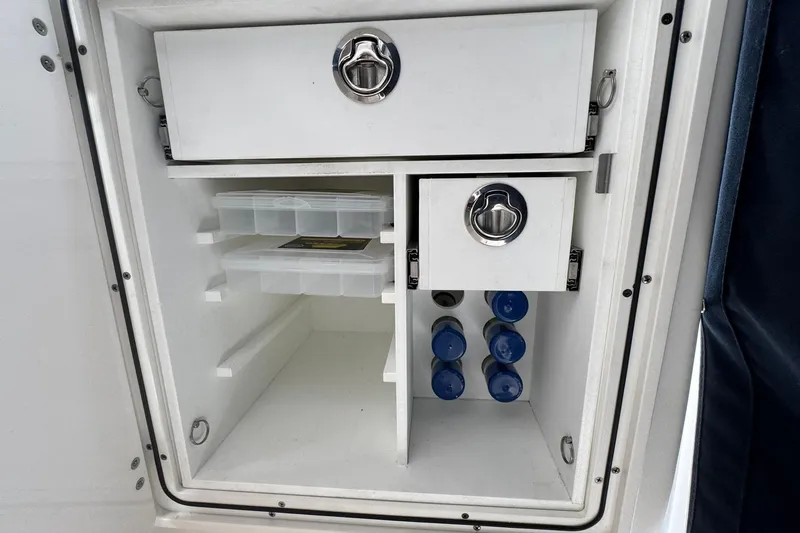  Yacht Photos Pics 2018 Pursuit OS 325 Offshore storage compartment with drawers and bottle holders.