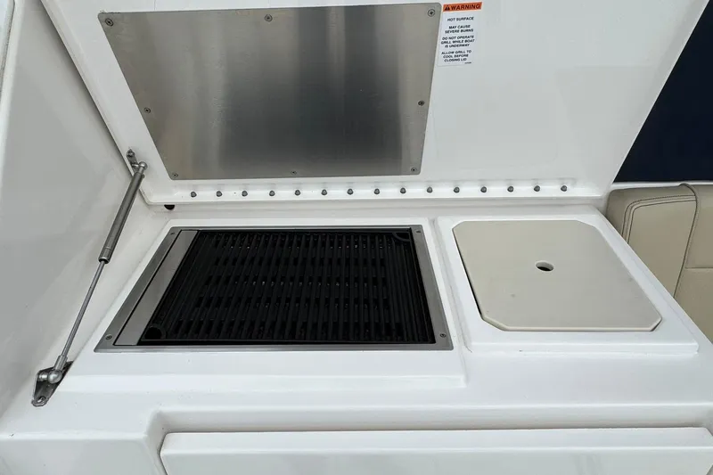  Yacht Photos Pics 2018 Pursuit OS 325 Offshore boat grill and prep station with stainless steel cover.