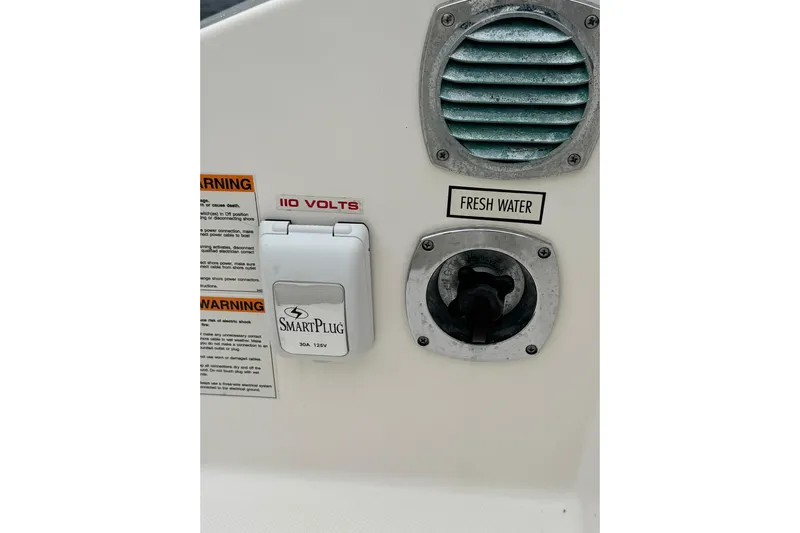  Yacht Photos Pics 2018 Pursuit OS 325 Offshore boat panel with SmartPlug and fresh water access.