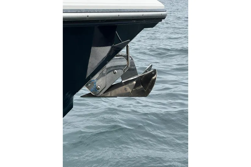  Yacht Photos Pics 2018 Pursuit OS 325 Offshore boat anchor over calm water.