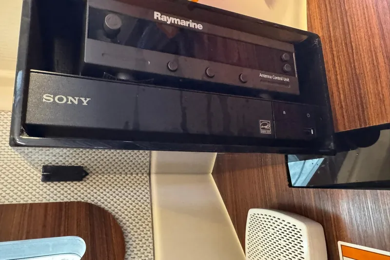  Yacht Photos Pics Control panel with Raymarine and Sony units on a 2018 Pursuit OS 325 Offshore boat.