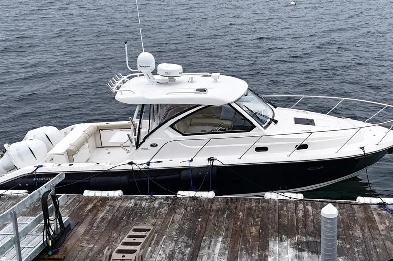  Yacht Photos Pics 2018 Pursuit OS 325 Offshore boat docked on calm water.
