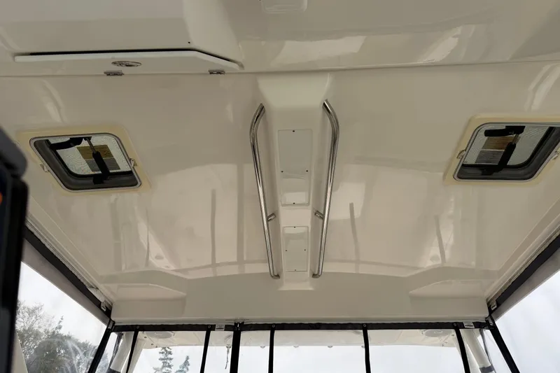  Yacht Photos Pics Ceiling view of 2018 Pursuit OS 325 Offshore boat with hatches and grab rails.