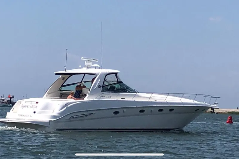  Yacht Photos Pics 2003 Sea Ray 460 Sundancer yacht cruising on open water.