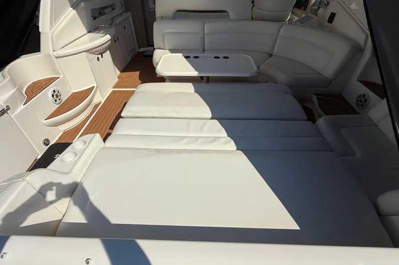  Yacht Photos Pics Luxurious interior of 2003 Sea Ray 460 Sundancer yacht with white seating and wood accents.