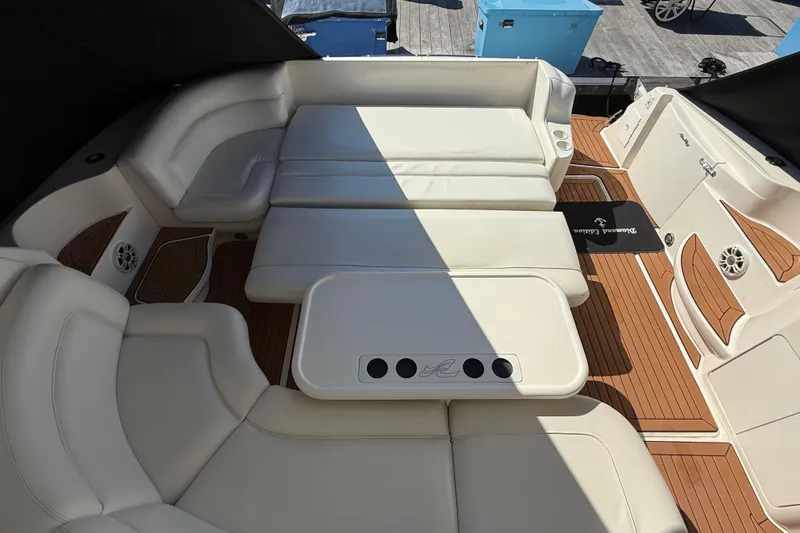  Yacht Photos Pics Luxurious seating area on a 2003 Sea Ray 460 Sundancer yacht with white cushions.