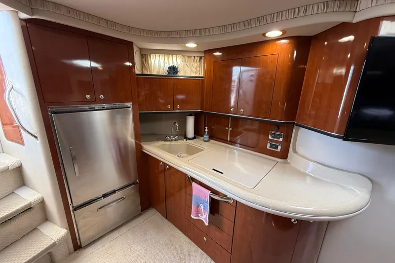  Yacht Photos Pics Luxurious 2003 Sea Ray 460 Sundancer yacht kitchen with sleek cabinetry and modern appliances.