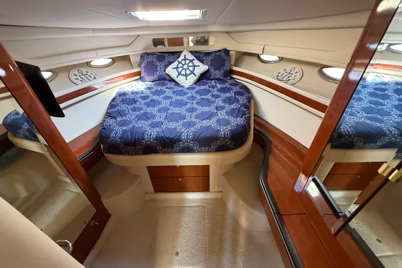  Yacht Photos Pics Luxurious cabin interior of 2003 Sea Ray 460 Sundancer yacht with nautical decor.