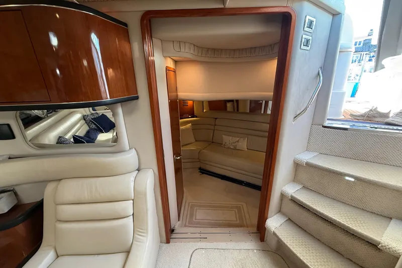  Yacht Photos Pics Luxurious interior of 2003 Sea Ray 460 Sundancer yacht with plush seating and elegant design.