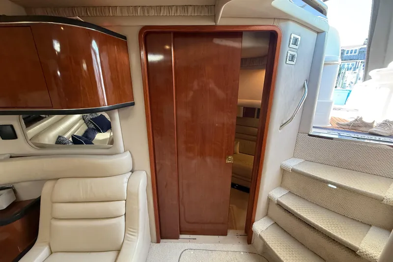  Yacht Photos Pics Interior of 2003 Sea Ray 460 Sundancer yacht with wooden cabinetry and plush seating.