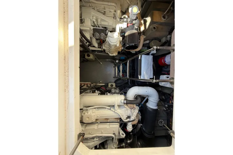  Yacht Photos Pics Engine compartment of a 2003 Sea Ray 460 Sundancer boat, showcasing mechanical components.