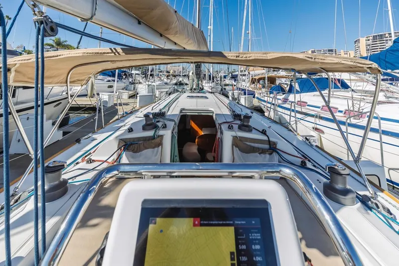 Sabbatical Yacht Photos Pics 2005 Beneteau First 44.7 sailboat deck view in marina, featuring navigation equipment.