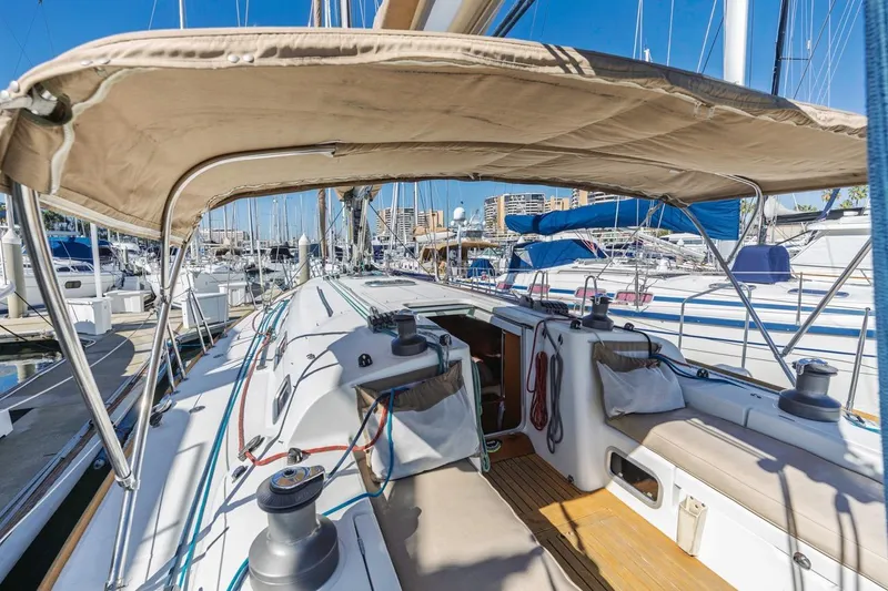 Sabbatical Yacht Photos Pics 2005 Beneteau First 44.7 sailboat cockpit with canopy, docked in marina.