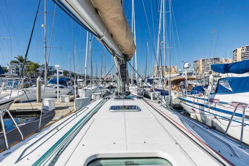 Sabbatical Yacht Photos Pics 2005 Beneteau First 44.7 sailboat docked in a marina, surrounded by other boats.