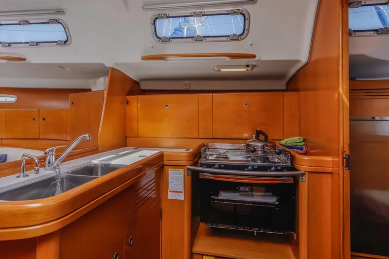 Sabbatical Yacht Photos Pics Interior of 2005 Beneteau First 44.7 yacht kitchen with stove and sink.