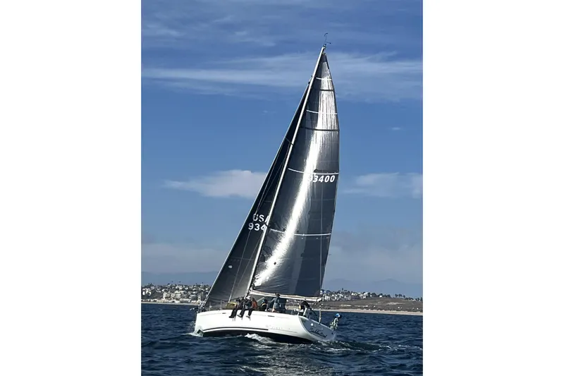 Sabbatical Yacht Photos Pics Sailing yacht Beneteau First 44.7 (2005) gliding on open water under clear skies.