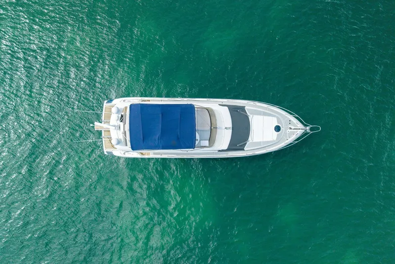  Yacht Photos Pics Aerial view of 2006 Sunseeker Manhattan 50 yacht on turquoise water.