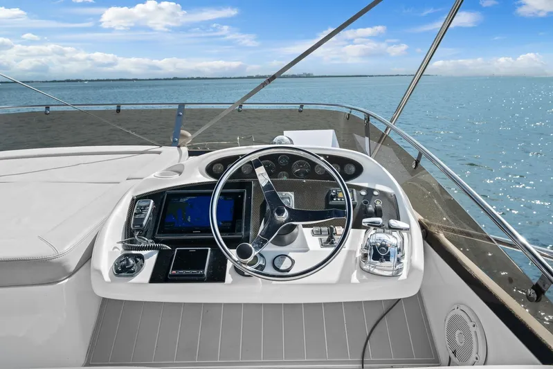  Yacht Photos Pics Helm of 2006 Sunseeker Manhattan 50 yacht with ocean view and navigation equipment.