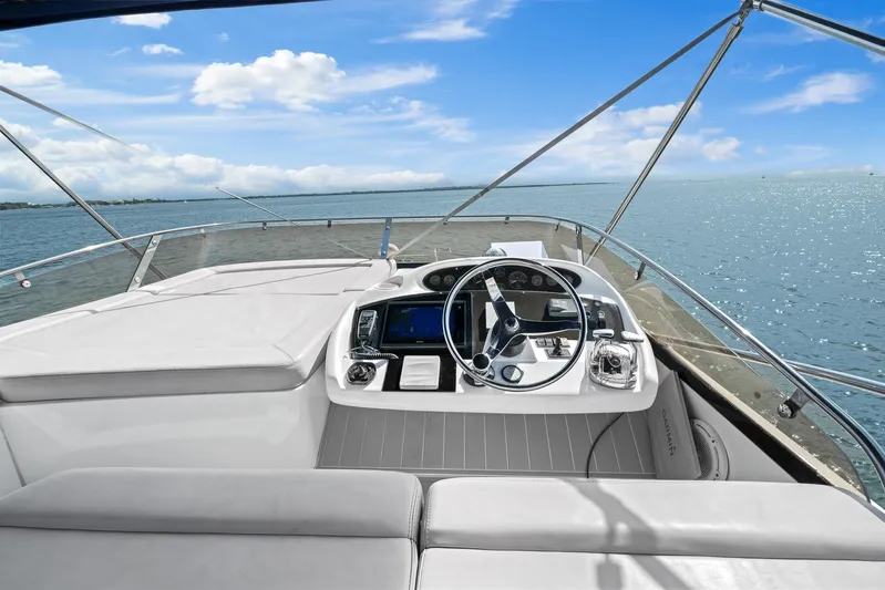  Yacht Photos Pics 2006 Sunseeker Manhattan 50 yacht helm with ocean view and clear blue sky.