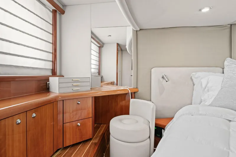  Yacht Photos Pics Luxurious cabin interior of 2006 Sunseeker Manhattan 50 yacht with elegant wood finish.