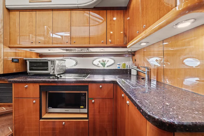  Yacht Photos Pics Luxurious kitchen interior of 2006 Sunseeker Manhattan 50 yacht with modern appliances.